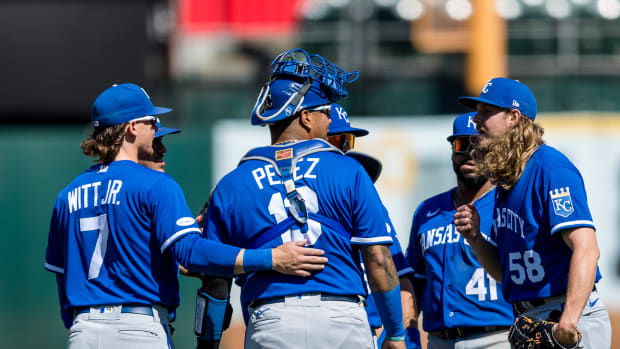Jun 18, 2022; Oakland, California, USA; Kansas City Royals shortstop Bobby Witt Jr. (7) and catcher Salvador Perez (13) and closing pitcher Scott Barlow (58) react after defeating the Oakland Athletics at RingCentral Coliseum. Mandatory Credit: John Hefti-USA TODAY Sports